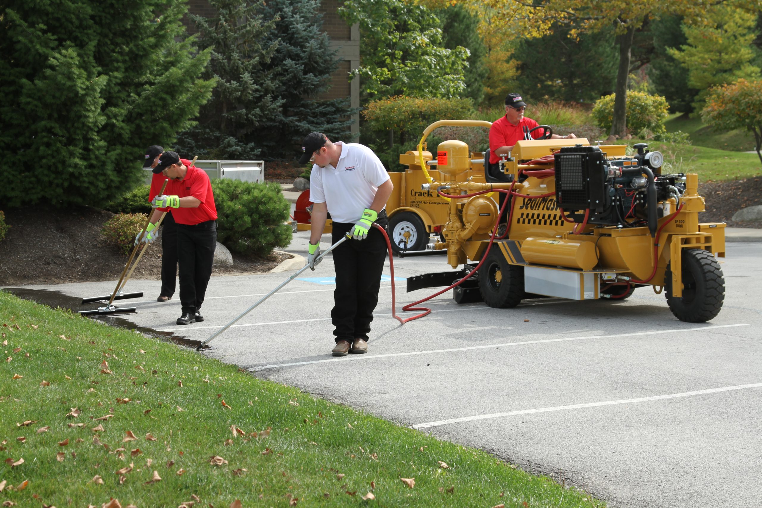 SealMaster equipment being used by sealcoating equipment.