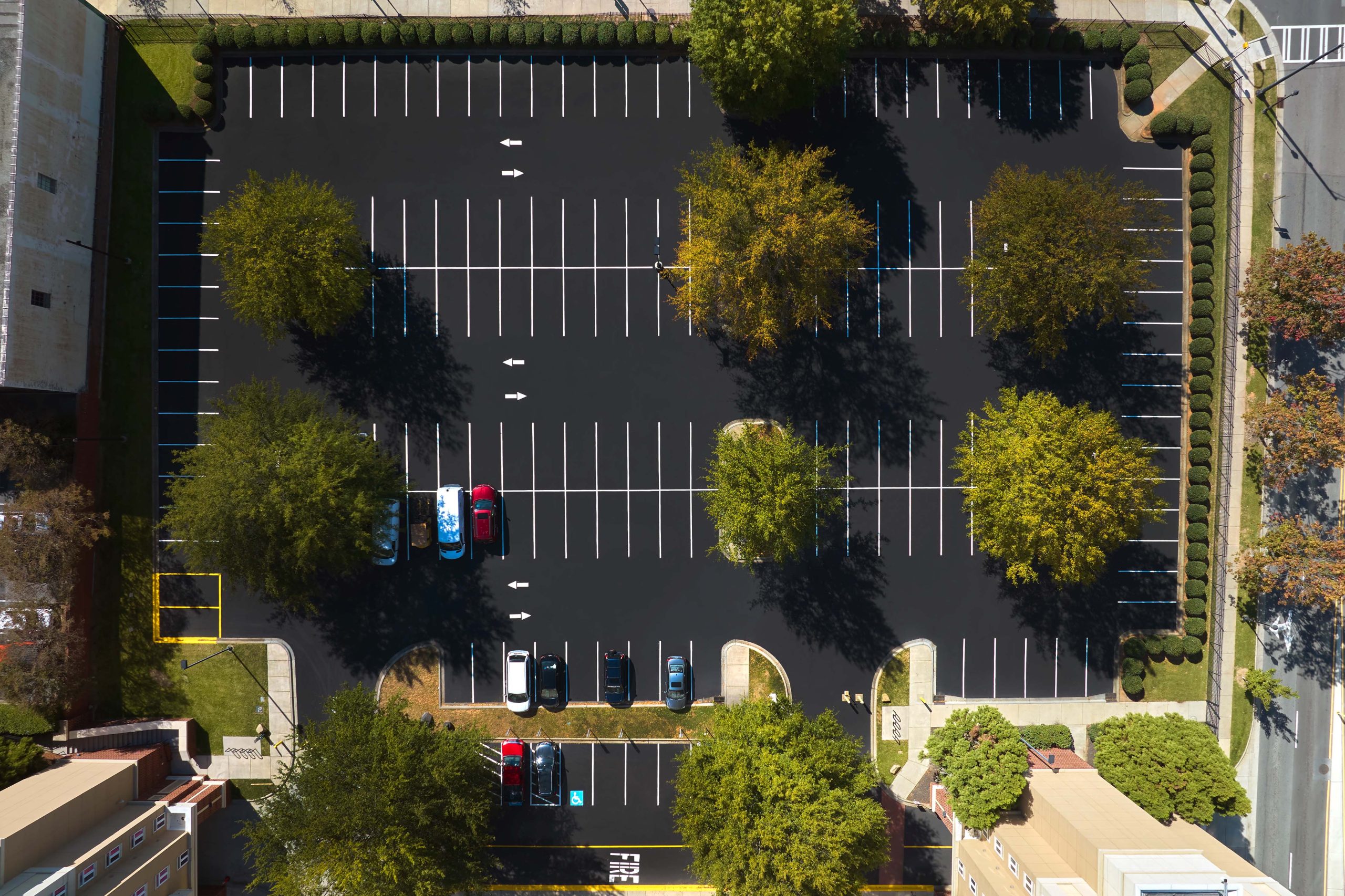 Aerial view of fresh sealed parking lot.