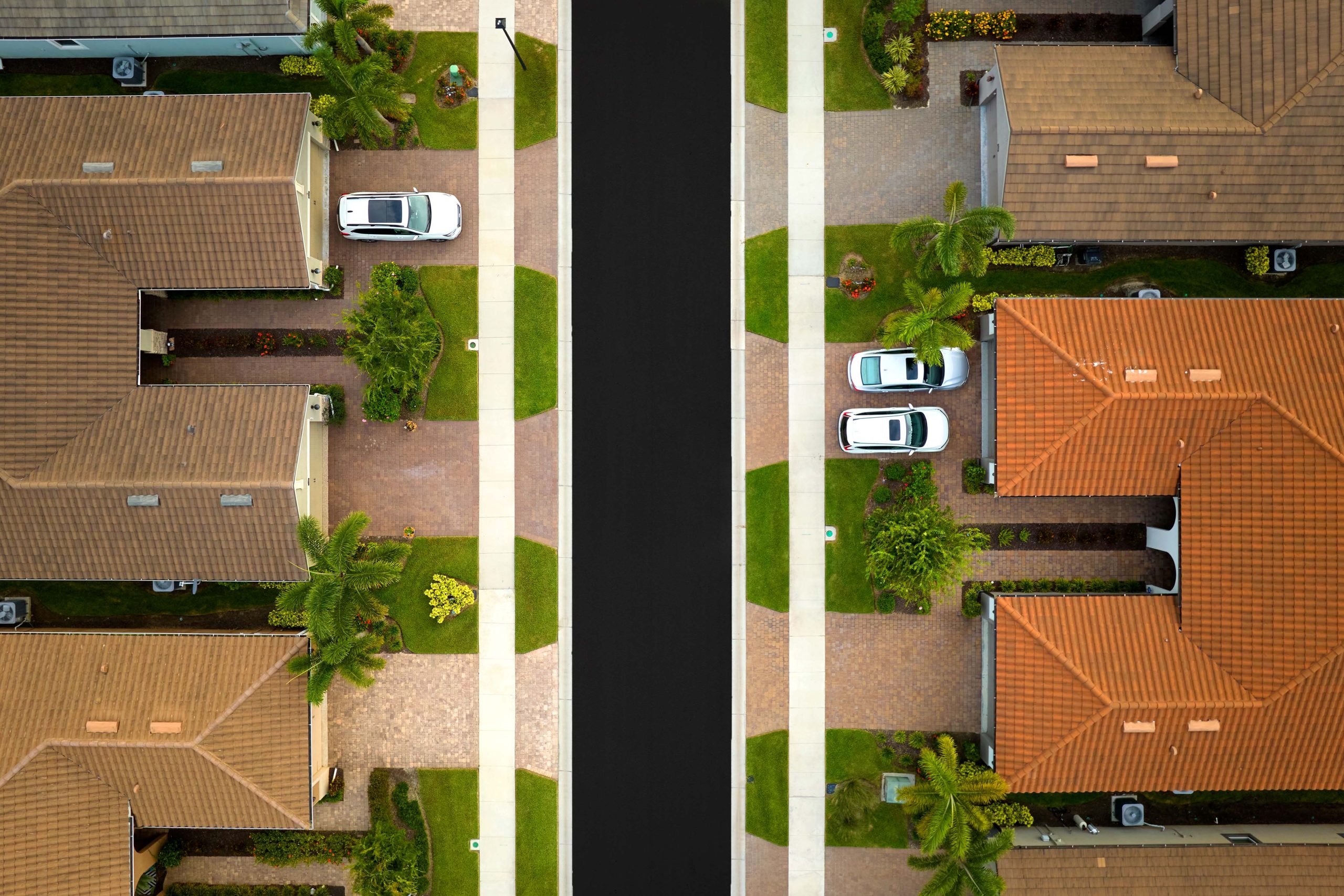 Aerial view of a freshly sealcoated road in residential area in Florida.