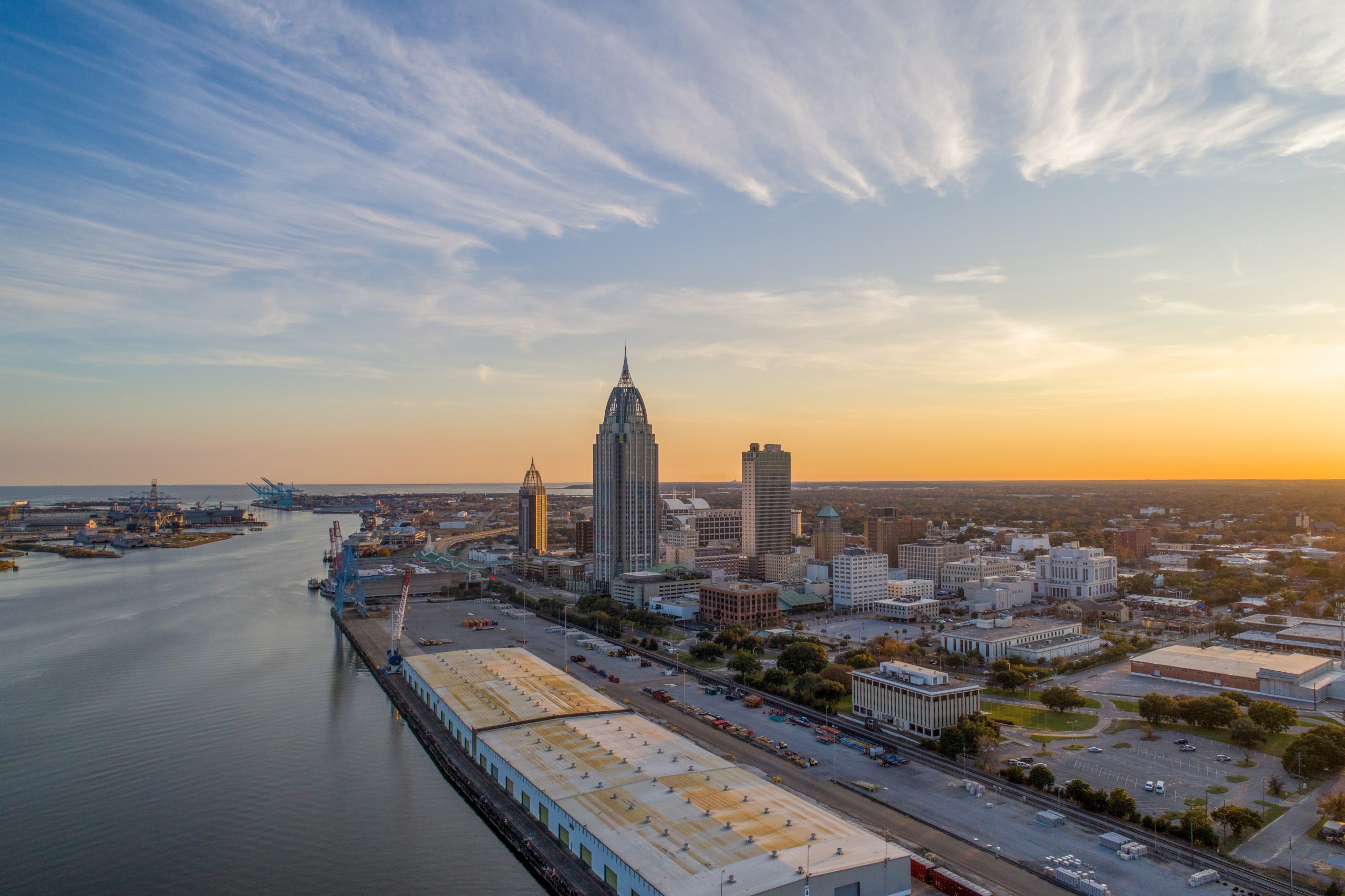 Aerial view of the downtown Mobile, Alabama waterfront at sunset