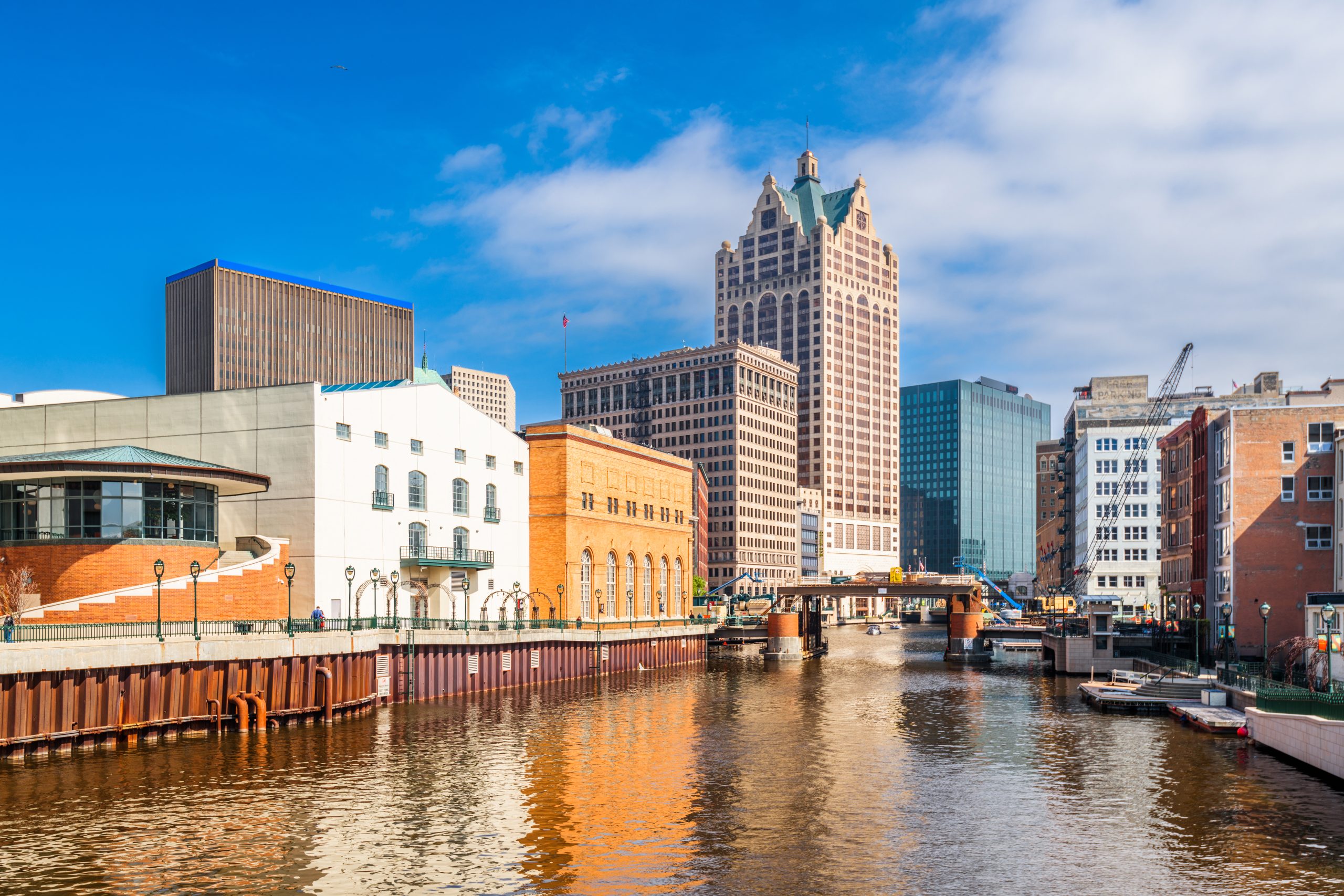 Milwaukee, Wisconsin, USA downtown skyline on the Milwaukee River in the daytime.