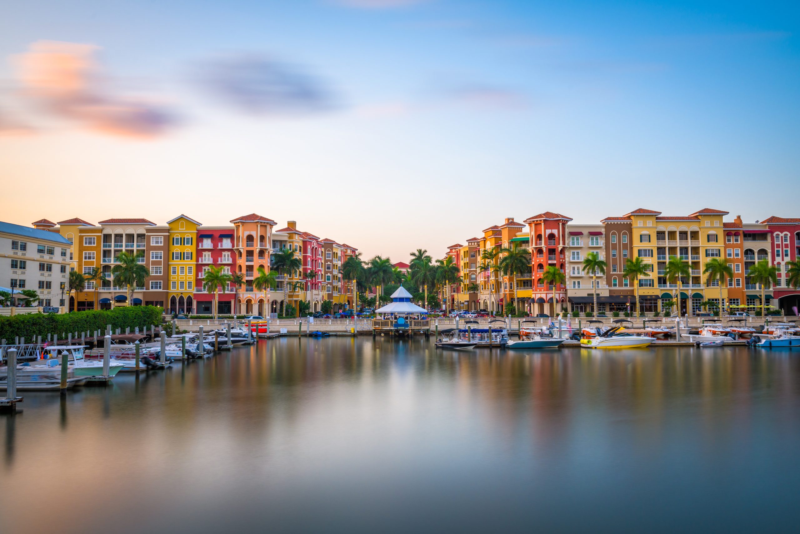 Naples, Florida, USA downtown cityscape on the bay at dusk.