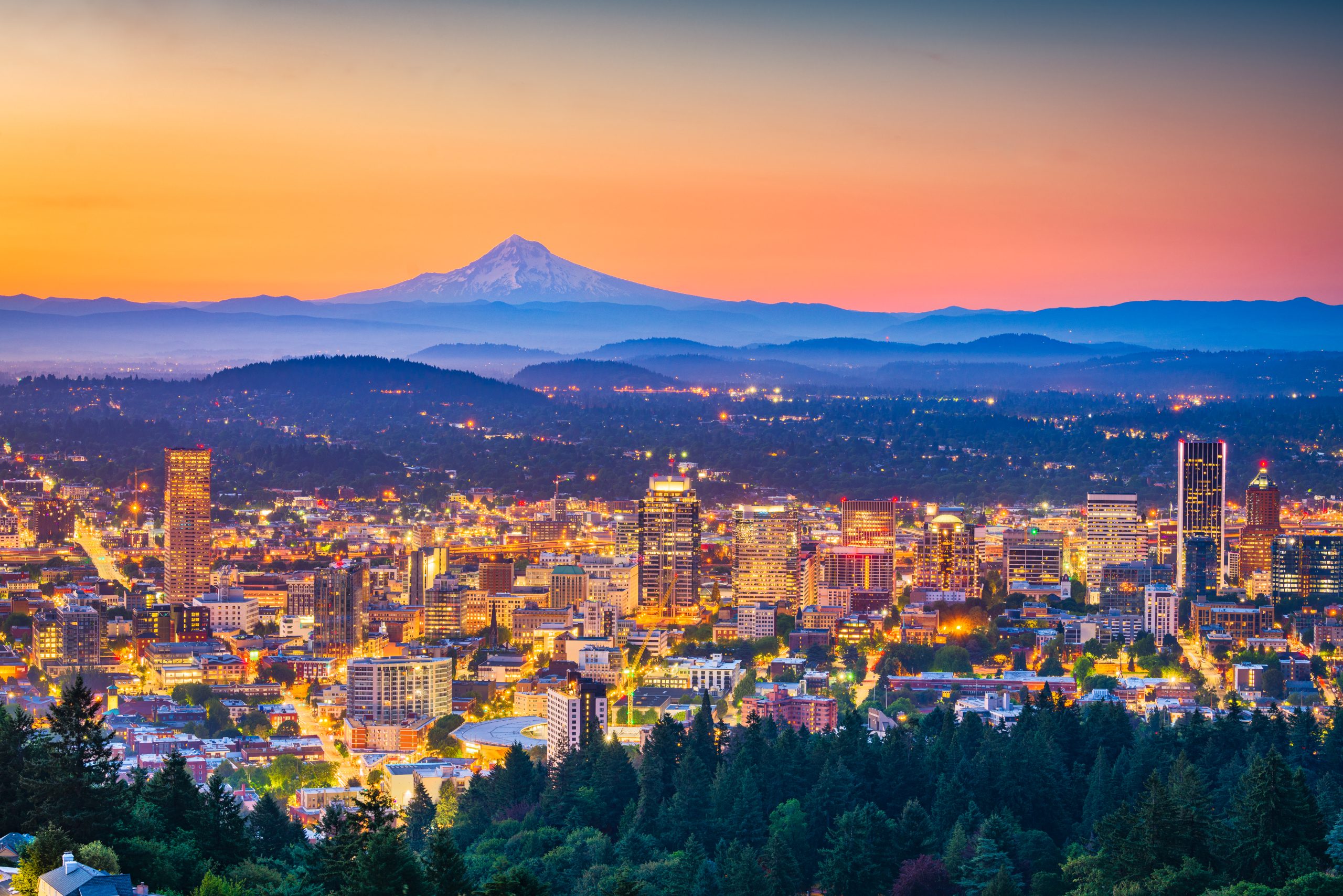 Portland, Oregon, USA downtown skyline with Mt. Hood at dawn.