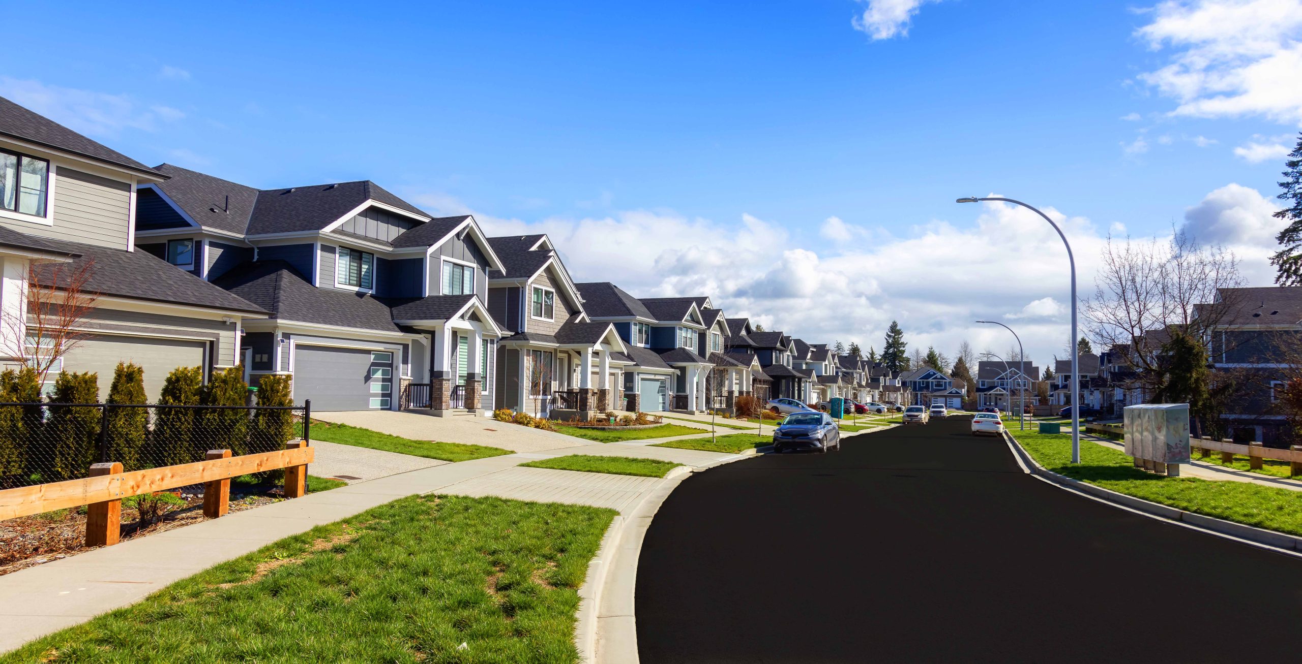 Freshly sealcoated road in modern suburb. 